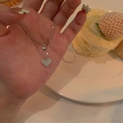 Collier double chaîne dorée avec anneau argenté