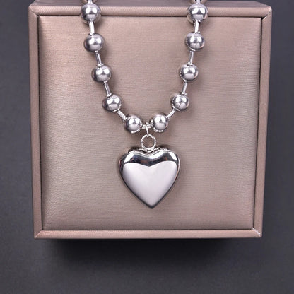 Collier boule argenté avec pendentif cœur