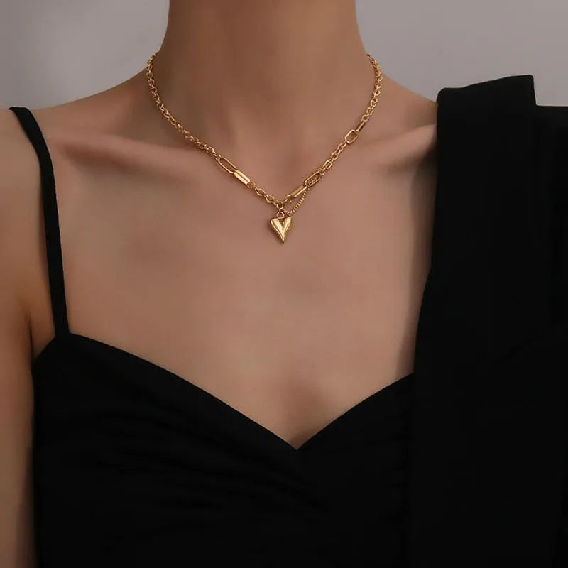 Collier double chaîne dorée avec anneau argenté