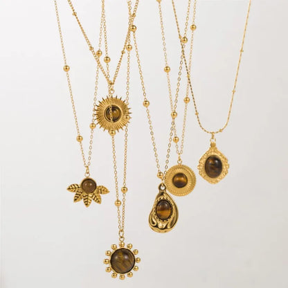 Collier doré médaillon œil de tigre vintage